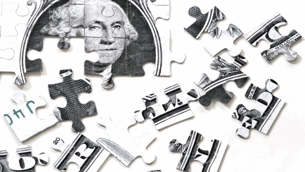 Dollar bill as puzzle pieces being put together